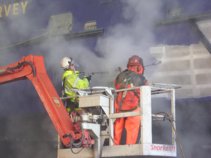 Side of a ship having Ultra High-Pressure Water Blasting (UHP)